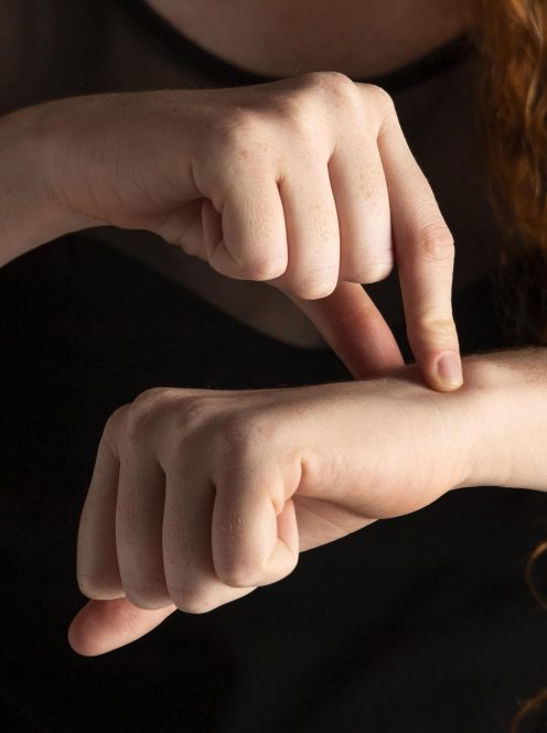 close-up-woman-teaching-sign-language