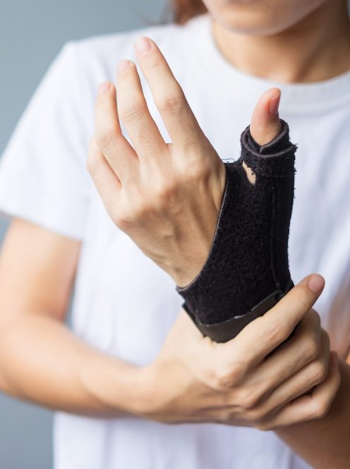 woman holding her wrist pain because using smartphone or computer long time. De Quervain's tenosynovitis, Intersection Symptom, Carpal Tunnel Syndrome or Office syndrome concept